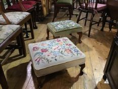 A beech stained upholstered footstool with handworked floral tapestry panel, with velvet border,