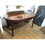 A Whytock & Reid mahogany wind out dining table, c.1920/30, the D end moulded top above a plain