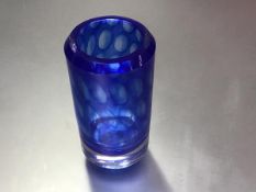 A Kosta Swedish circular cased glass vase with blue outlined oval design, signed verso (h.17cm x d.