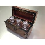 A Victorian walnut glass and metal mounted perfume dome top box including a set of three perfume