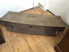 A 19thc French rustic oak carriage box, the rectangular bowed hinged top enclosing a plain interior,