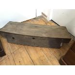 A 19thc French rustic oak carriage box, the rectangular bowed hinged top enclosing a plain interior,