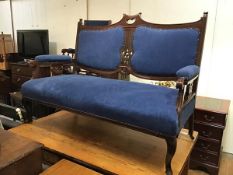 An Edwardian mahogany two seater drawing room sofa with pierced centre and upholstered panel back,