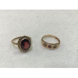 A 15ct gold ruby and pearl ring and a 9ct gold oval garnet set ring with rope pattern border (stone: