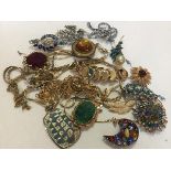 A collection of 1970s gilt metal chain necklaces and 1950s/60s paste set brooches (a lot)