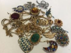 A collection of 1970s gilt metal chain necklaces and 1950s/60s paste set brooches (a lot)