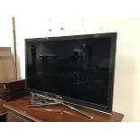 A Samsung LCD televison, model UE40C6540SK, complete with remote control and anodised metal stand