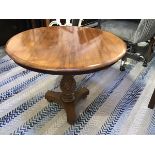 A mahogany occasional table, the circular top with moulded edge raised on spiral baluster column and