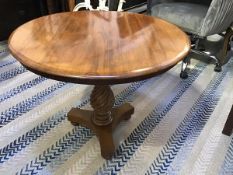 A mahogany occasional table, the circular top with moulded edge raised on spiral baluster column and