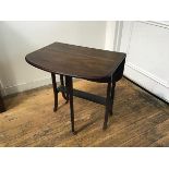 An Edwardian mahogany sutherland tea table with rounded angles and twin drop flaps, raised on square