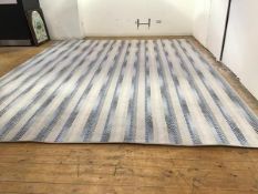 A modern Axminster carpet of alternating blue grey and white chevron design, pale grey/white
