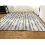 A modern Axminster carpet of alternating blue grey and white chevron design, pale grey/white