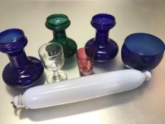 A collection of glass to include two Bristol blue glass hyacinth vases, a green glass hyacinth vase,