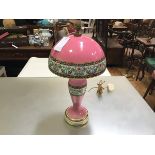A 19thc china baluster table lamp with mushroom dome shade and brass flame finial (shade
