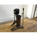 A hammered finish copper 1930s companion set comprising a poker, shovel, tongs, brush etc. (h.26cm)