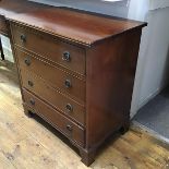 An Edwardian mahogany chest, the rectangular top with fluted edge above four long drawers, raised on