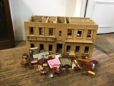 A plywood doll's mansionhouse in unfinished condition, with slide out panels, partitions etc.,