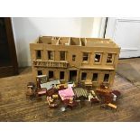 A plywood doll's mansionhouse in unfinished condition, with slide out panels, partitions etc.,