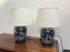 A pair of modern Chinese ginger jar style table lamps of ovoid form, with stylised peach design,