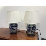 A pair of modern Chinese ginger jar style table lamps of ovoid form, with stylised peach design,