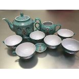 A modern Chinese turquoise ground floral decorated part teaset including teapot, sugar basin, five