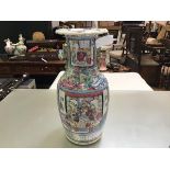 A 19thc Chinese vase decorated with traditional warrior figures and interior scenes and landscapes