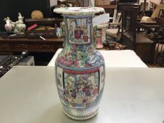 A 19thc Chinese vase decorated with traditional warrior figures and interior scenes and landscapes