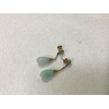 A pair of pale celadon jadeite pear shaped drop earrings mounted on 14ct gold chain and post (4cm