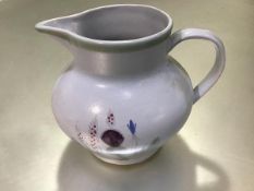 A Scottish Buchan pottery jug decorated with thistle design, signed verso (h.17cm x d. 11cm)