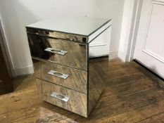 A mirrored three drawer bedside chest, with chrome handles (h.67cm x 45cm x 44cm)