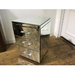 A mirrored three drawer bedside chest, with chrome handles (h.67cm x 45cm x 44cm)