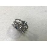 An 18ct white gold diamond floral cluster triple band ring, complete with original purchase document