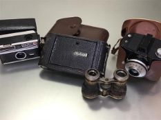 A Kodak folding camera complete with original case, an Agfa Clack German camera, a pair of opera