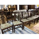 A harlequin set of 19thc and earlier dining chairs including a pair of Georgian oak pierced carved