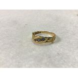 An 18ct gold three stone sapphire and rose cut diamond ring (2.47g)