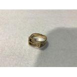 A 9ct gold buckle style engraved ring (5.8g)