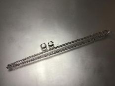 A white metal flatlink chain necklace, stamped 21k tested as (24cm), with matching pair of engraved