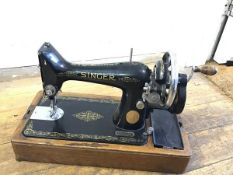 A Singer Manufacturing Company hand sewing machine, model EC574608, complete with instructions (