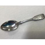 A Victorian silver fiddle pattern serving spoon with elaborately engraved decoration, Joshua Gregor,