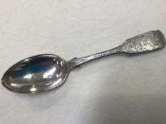 A Victorian silver fiddle pattern serving spoon with elaborately engraved decoration, Joshua Gregor,