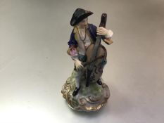 A Samson Derby 19thc porcelain figure of a Seated Cellist, raised on gilt socolo base, decorated