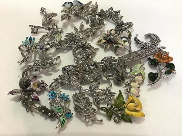 A collection of 1950s marcasite and enamelled floral leaf mounted brooches etc. (a lot)