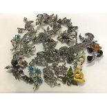 A collection of 1950s marcasite and enamelled floral leaf mounted brooches etc. (a lot)
