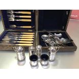 A Birmingham silver six piece condiment set comprising two drum style mustards (h.7cm) complete with