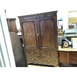 A George III mahogany linen press, the moulded cornice above a pair of fielded crossbanded panel