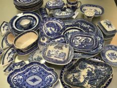 A large collection of 19thc English blue and white transfer printed country house ashets, tureens,