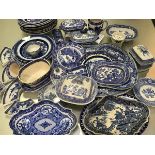 A large collection of 19thc English blue and white transfer printed country house ashets, tureens,