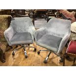 A pair of chromium plated velour upholstered tub chairs with pleated sides, on five prong
