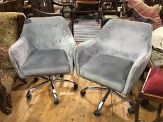 A pair of chromium plated velour upholstered tub chairs with pleated sides, on five prong