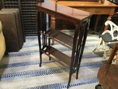 An Edwardian mahogany book table, the rectangular top with moulded edge and pierced frieze, fitted